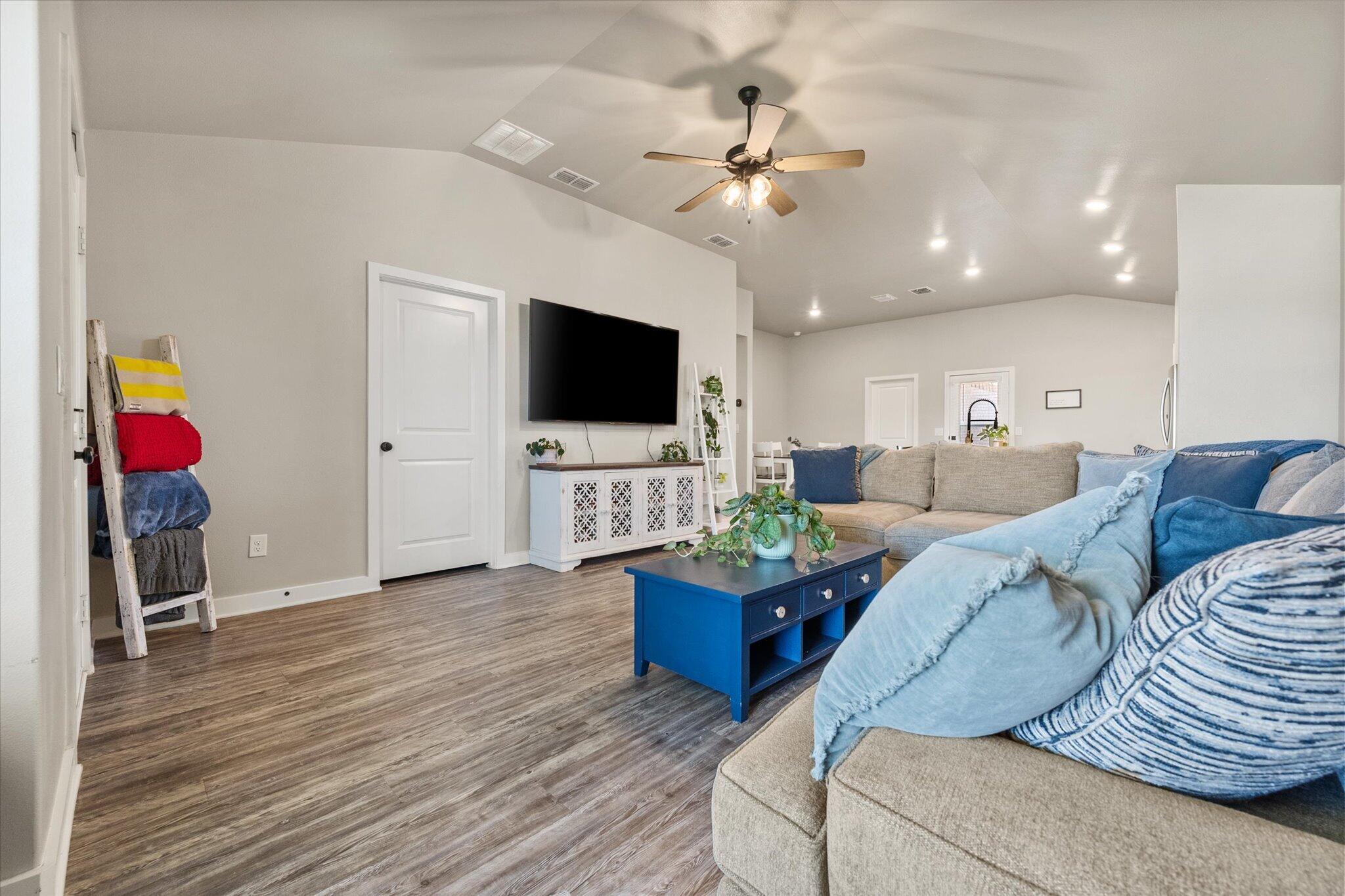 1902 137th Street Lubbock, TX 79423 - Photo 8 of 27 a living room with furniture and a flat screen tv