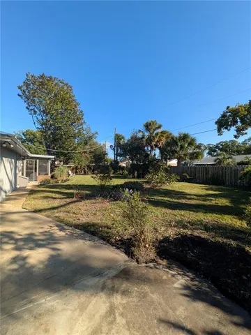 a view of a swimming pool with an outdoor space and seating area