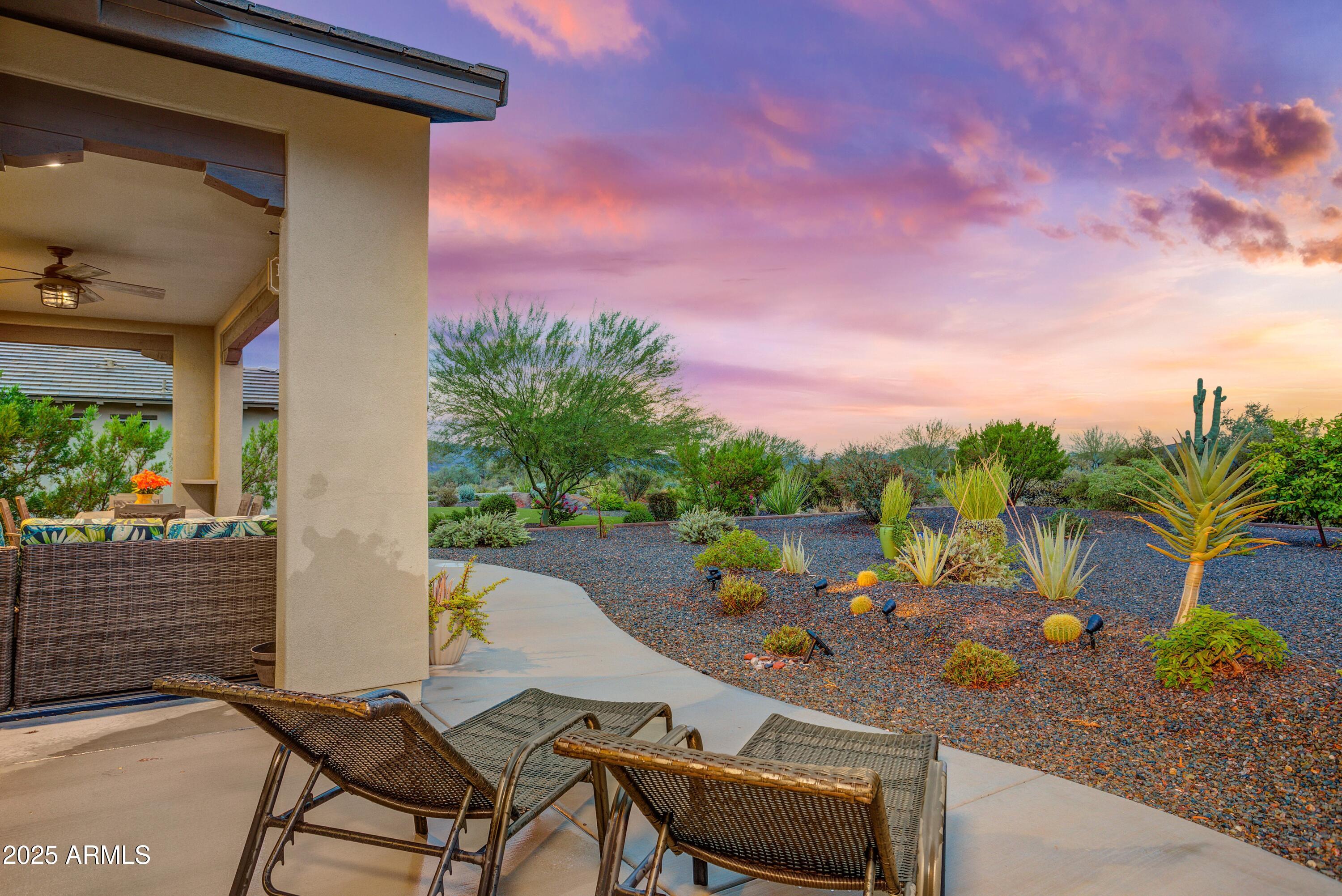 17919 East Slide Rock Drive Rio Verde, AZ 85263 - Photo 28 of 48 a view of a backyard with plants and a patio