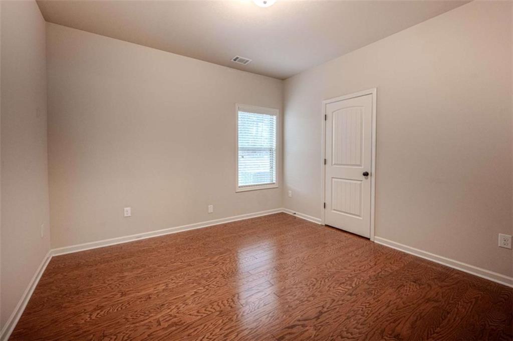 205 Heritage Stroll Athens, GA 30606 - Photo 19 of 30 a view of an empty room and window