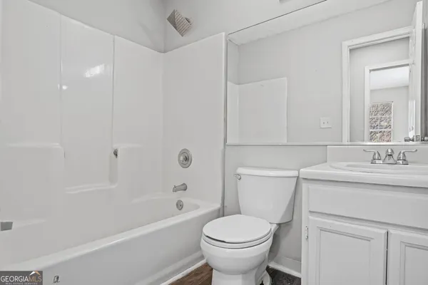 a bathroom with a sink a toilet and a bathtub