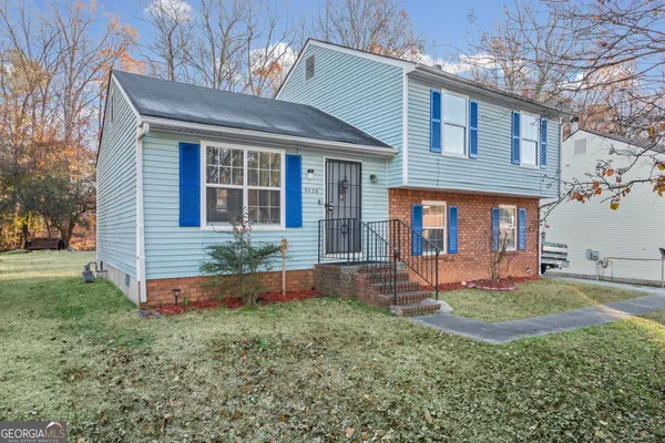front view of a house with a yard