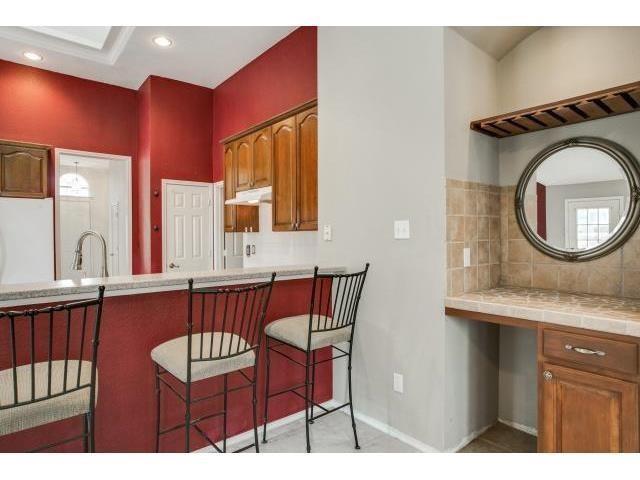 2026 Fox Glen Drive Allen, TX 75013 - Photo 13 of 17 a bathroom with a sink a mirror and a toilet