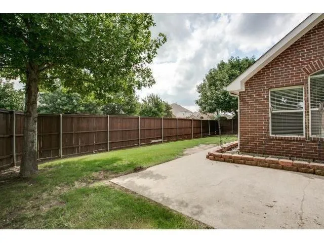 a view of backyard with green space