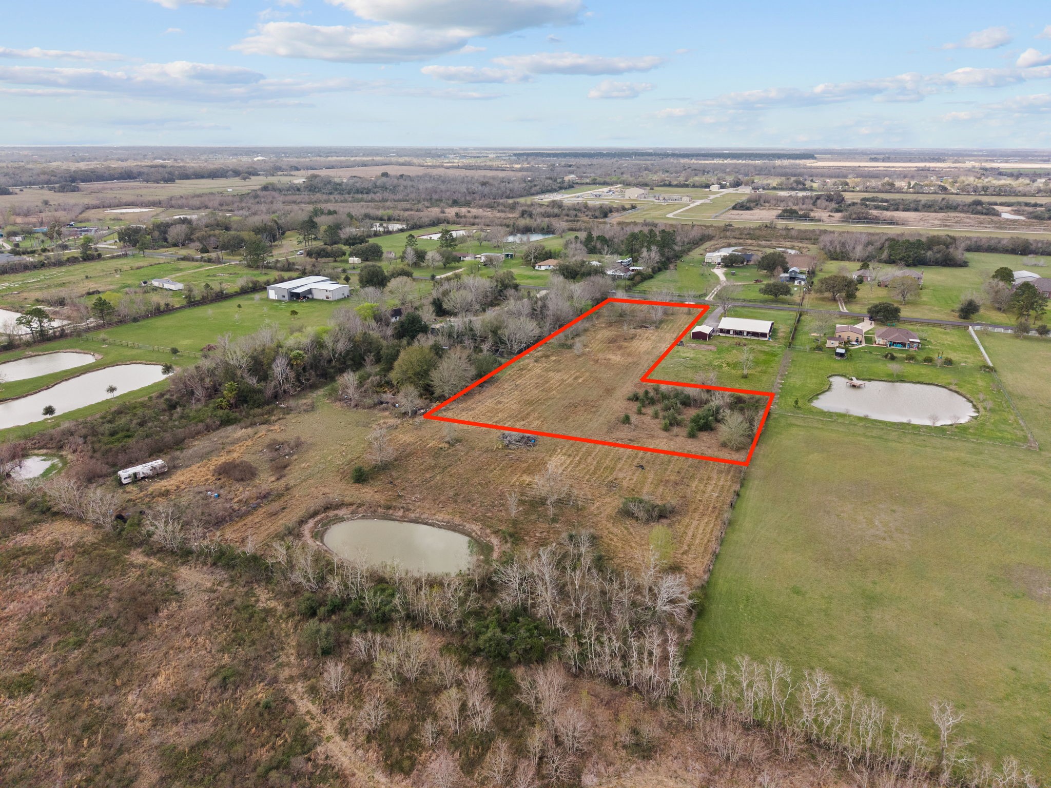 17 County Road 533 Angleton, TX 77515 - Photo 5 of 6 an aerial view of a residential houses with outdoor space