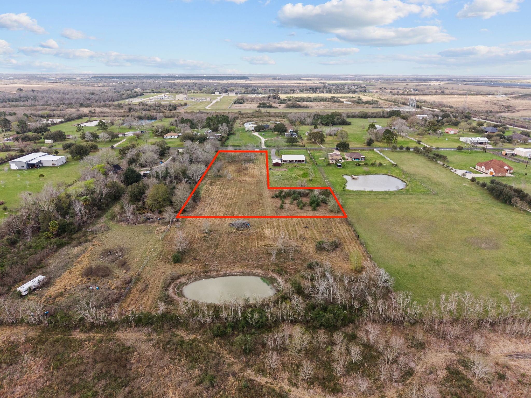 17 County Road 533 Angleton, TX 77515 - Photo 6 of 6 an aerial view of residential houses with outdoor space