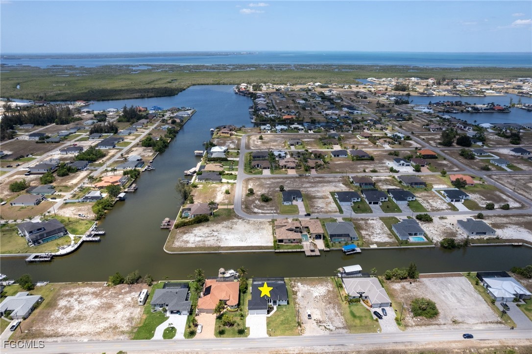 2702 Old Burnt Store Road North Cape Coral, FL 33993 - Photo 17 of 44 an aerial view of ocean and residential houses with outdoor space