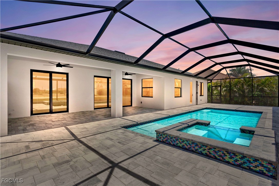 2702 Old Burnt Store Road North Cape Coral, FL 33993 - Photo 2 of 44 a front view of a house with garden