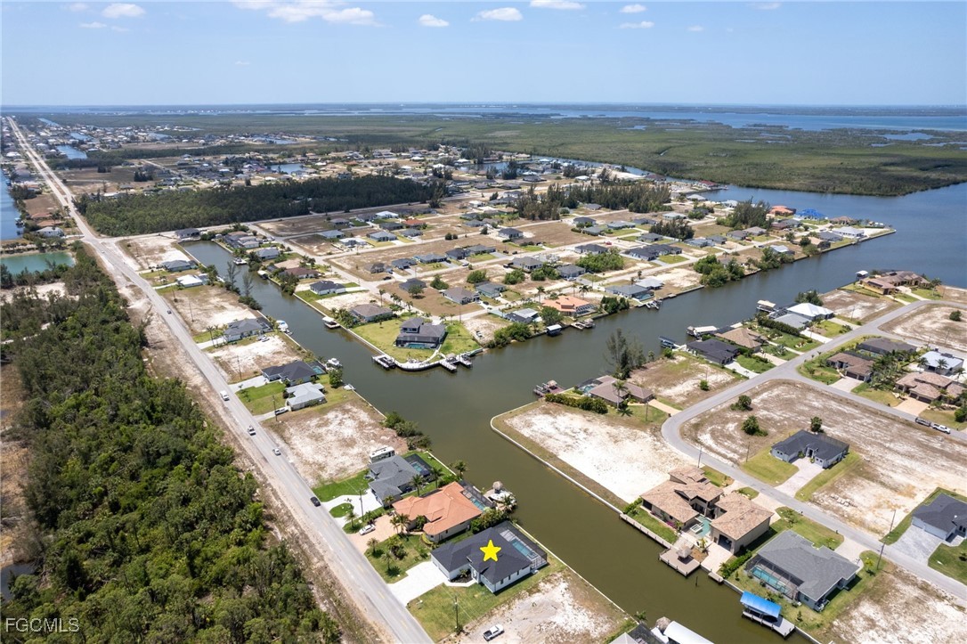 2702 Old Burnt Store Road North Cape Coral, FL 33993 - Photo 30 of 44 an aerial view of a city with ocean view