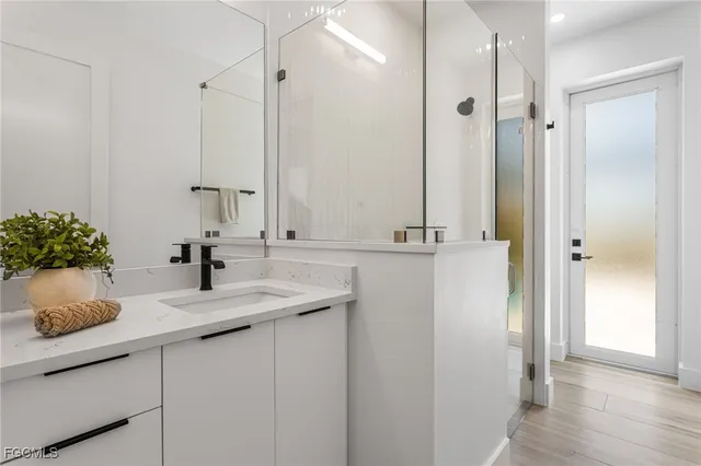 a bathroom with a sink and a mirror