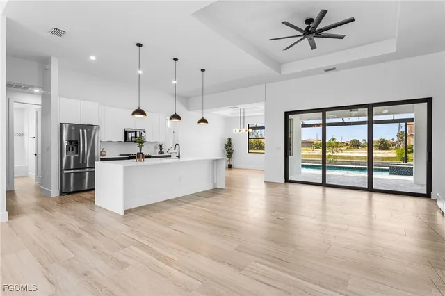 a view of kitchen with cabinets and stainless steel appliances