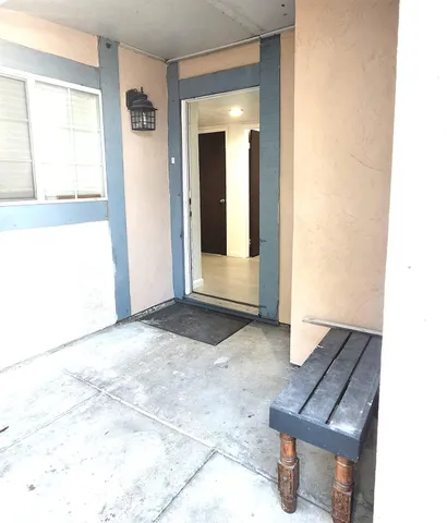 a view of an entryway with wooden floor