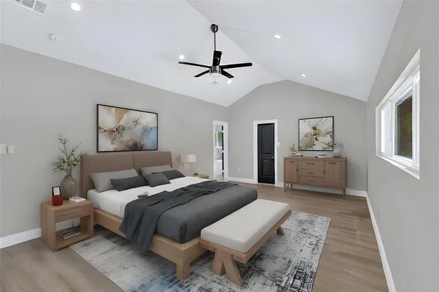 a kitchen with a sink cabinets and wooden floor