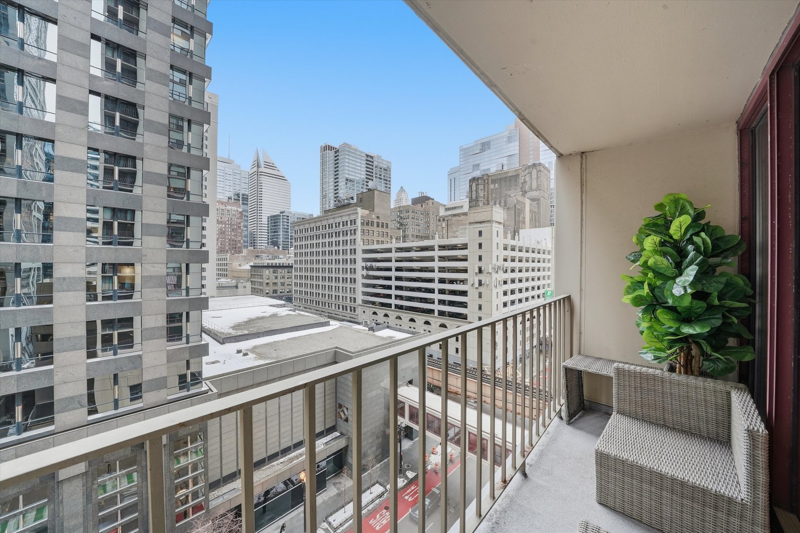 200 North Dearborn Street, Unit 906 Chicago, IL 60601 - Photo 12 of 15 a view of balcony with a potted plant and stairs