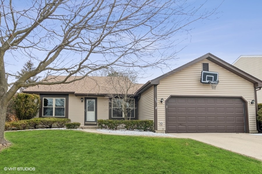 309 North Oltendorf Road Streamwood, IL 60107 - Photo 1 of 11 a front view of a house with a yard and garage