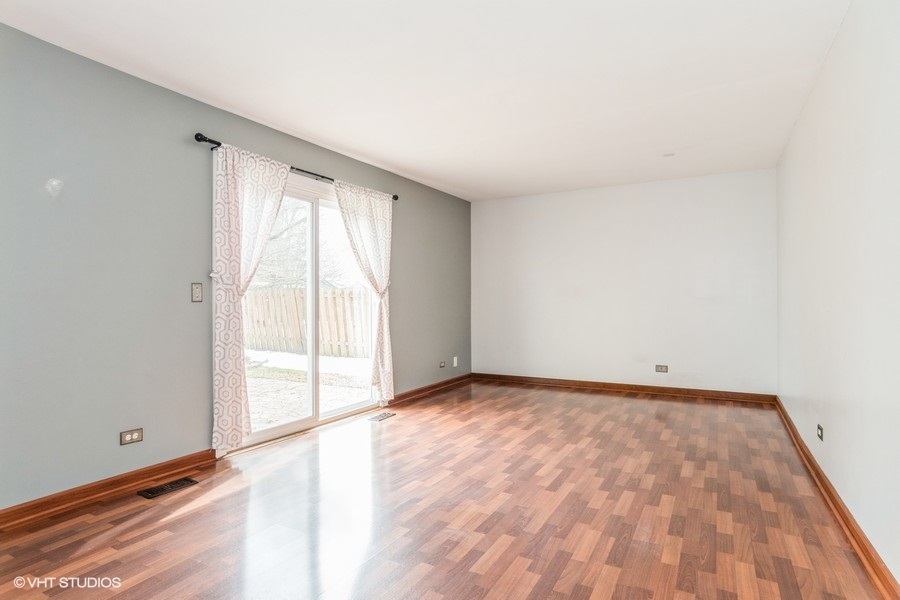 309 North Oltendorf Road Streamwood, IL 60107 - Photo 7 of 11 a view of an empty room and window