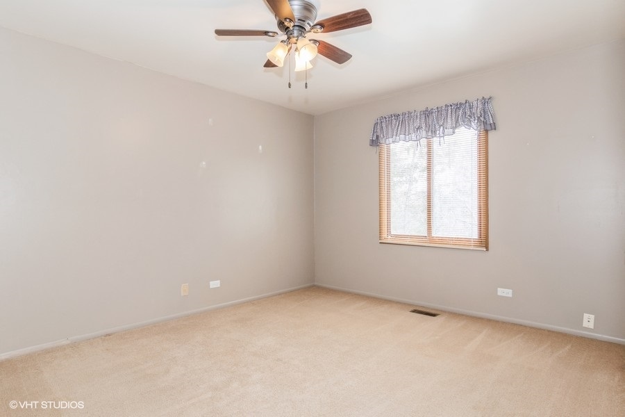 309 North Oltendorf Road Streamwood, IL 60107 - Photo 8 of 11 an empty room with windows and fan