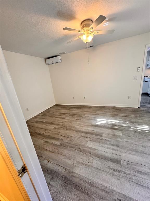 421 Australian Way Davenport, FL 33897 - Photo 11 of 14 a view of empty room with wooden floor