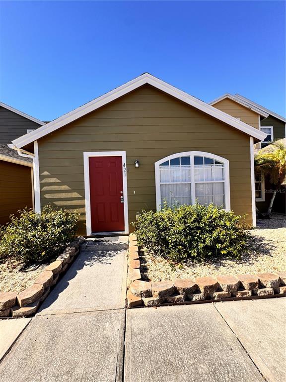 421 Australian Way Davenport, FL 33897 - Photo 2 of 14 a front view of house with yard