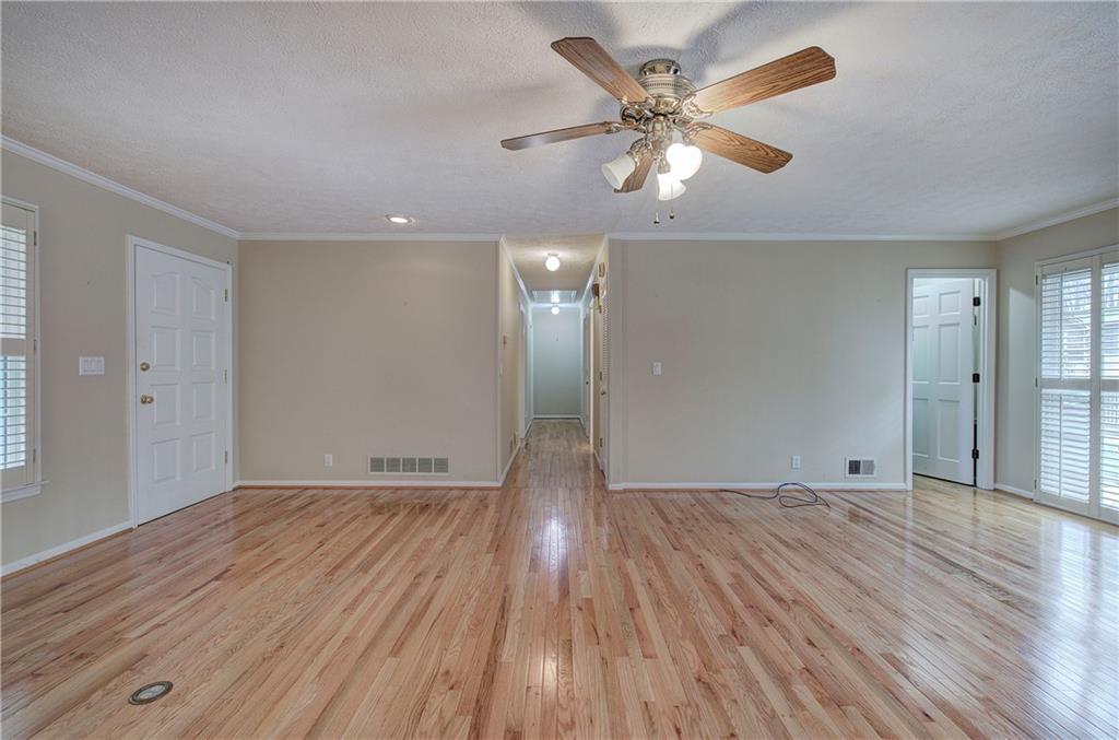 408 Mac Johnson Road Northwest Cartersville, GA 30121 - Photo 13 of 62 wooden floor in an empty room with a window