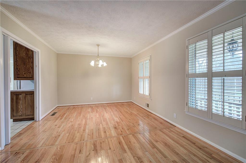408 Mac Johnson Road Northwest Cartersville, GA 30121 - Photo 14 of 62 wooden floor in an empty room with a window