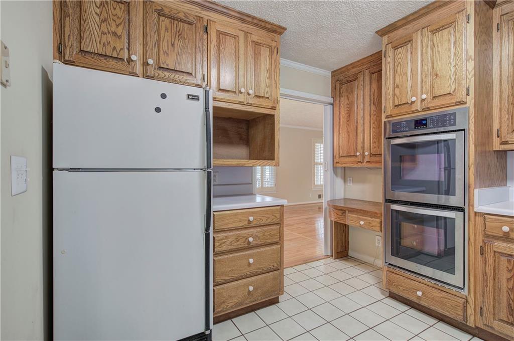 408 Mac Johnson Road Northwest Cartersville, GA 30121 - Photo 18 of 62 a kitchen with stainless steel appliances granite countertop a refrigerator and cabinets