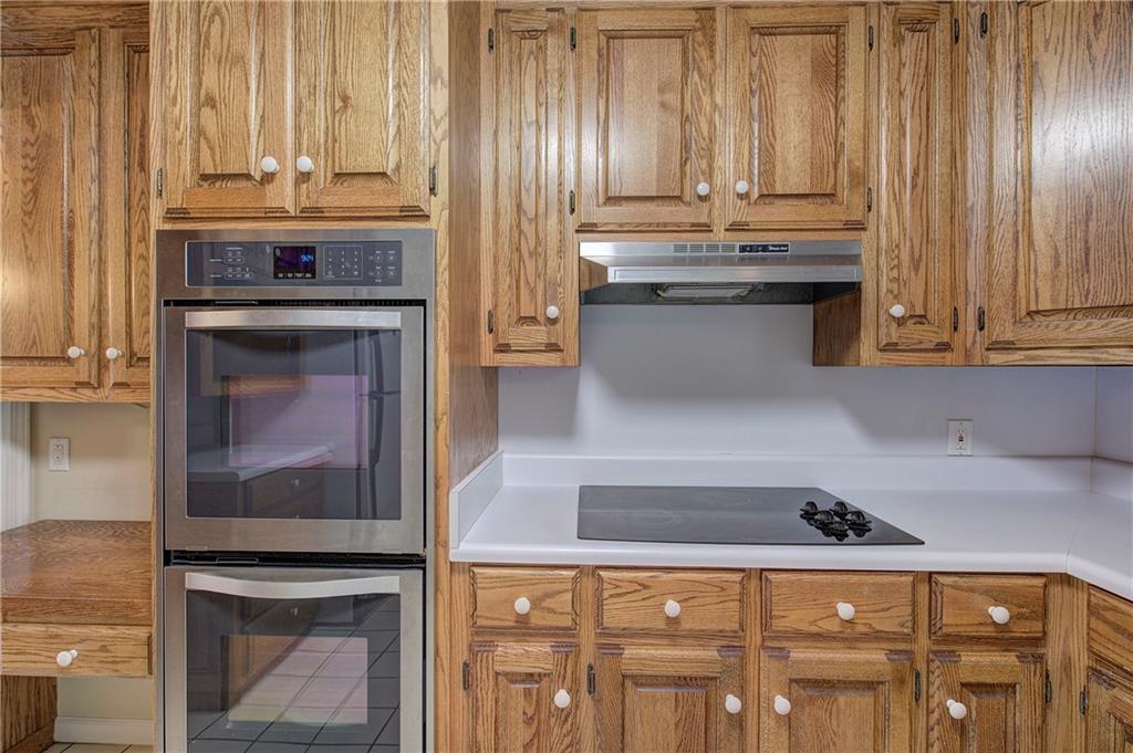 408 Mac Johnson Road Northwest Cartersville, GA 30121 - Photo 23 of 62 a kitchen with granite countertop a stove and a fireplace