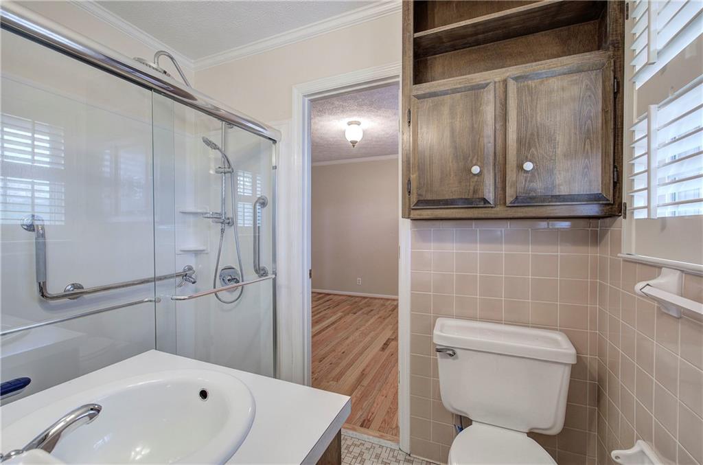 408 Mac Johnson Road Northwest Cartersville, GA 30121 - Photo 31 of 62 a bathroom with a toilet sink and shower