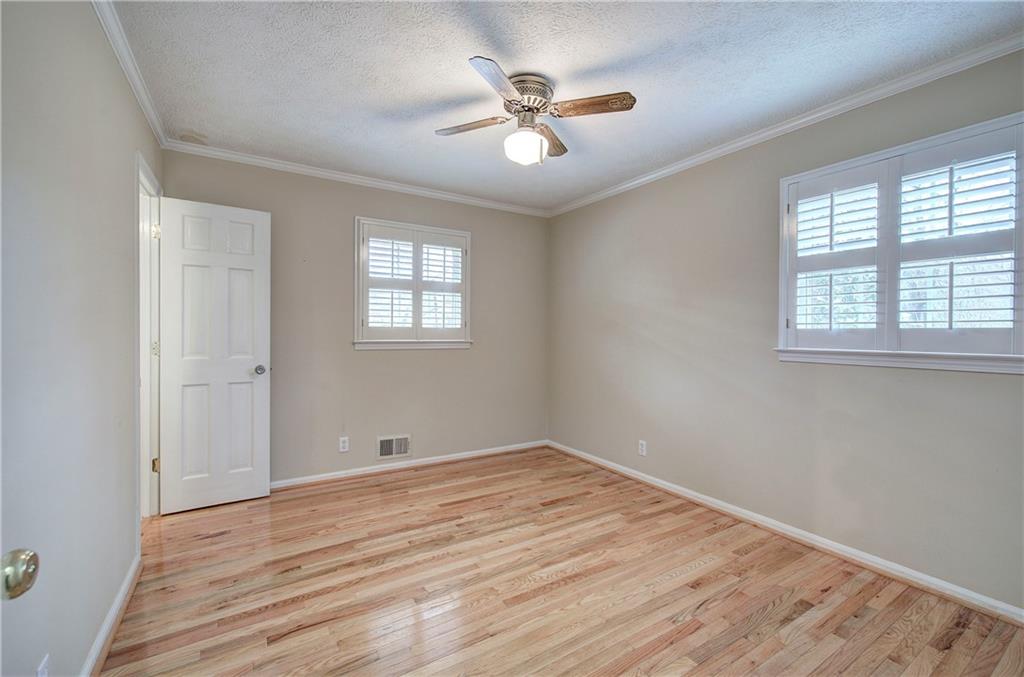 408 Mac Johnson Road Northwest Cartersville, GA 30121 - Photo 32 of 62 a view of empty room with wooden floor and fan
