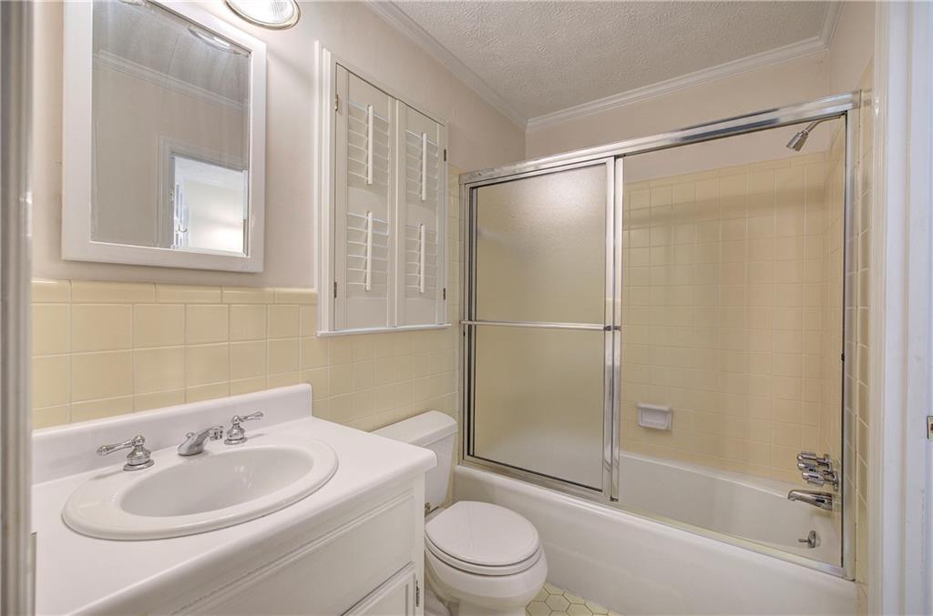 408 Mac Johnson Road Northwest Cartersville, GA 30121 - Photo 37 of 62 a bathroom with a sink toilet and shower