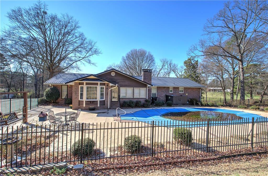 408 Mac Johnson Road Northwest Cartersville, GA 30121 - Photo 51 of 62 a front view of house a yard with trees