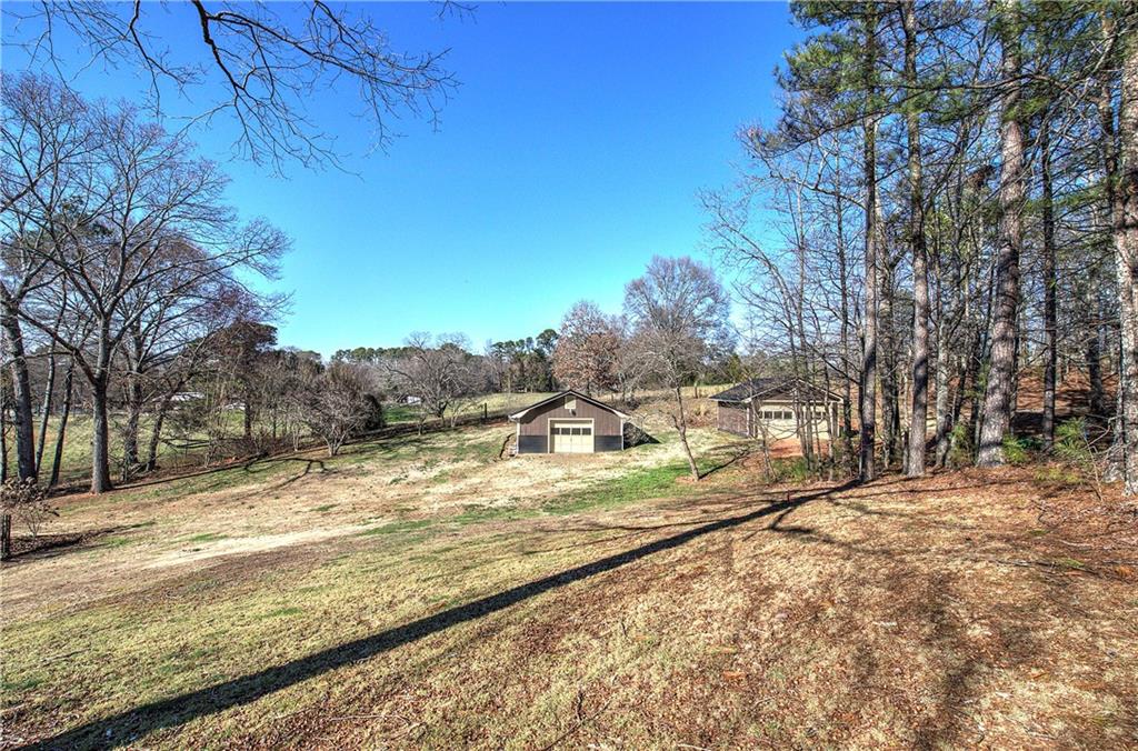 408 Mac Johnson Road Northwest Cartersville, GA 30121 - Photo 55 of 62 a view of a yard with wooden fence