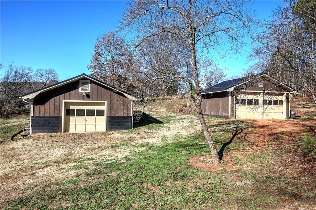 408 Mac Johnson Road Northwest Cartersville, GA 30121 - Photo 57 of 62 a house with trees in the background