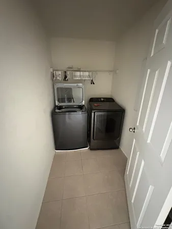a kitchen with a stove top oven and cabinets