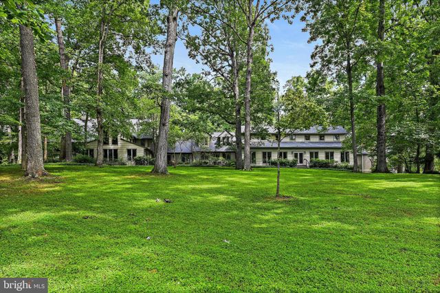 a bedroom with furniture and wooden floor