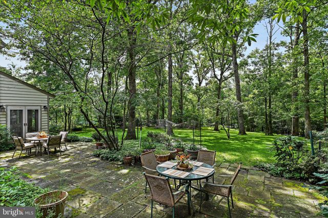 a view of a room with furniture and wooden floor