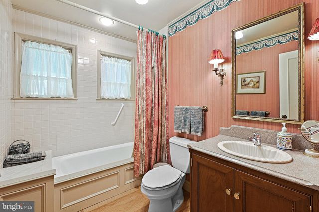 a bedroom with a large bed and a large window