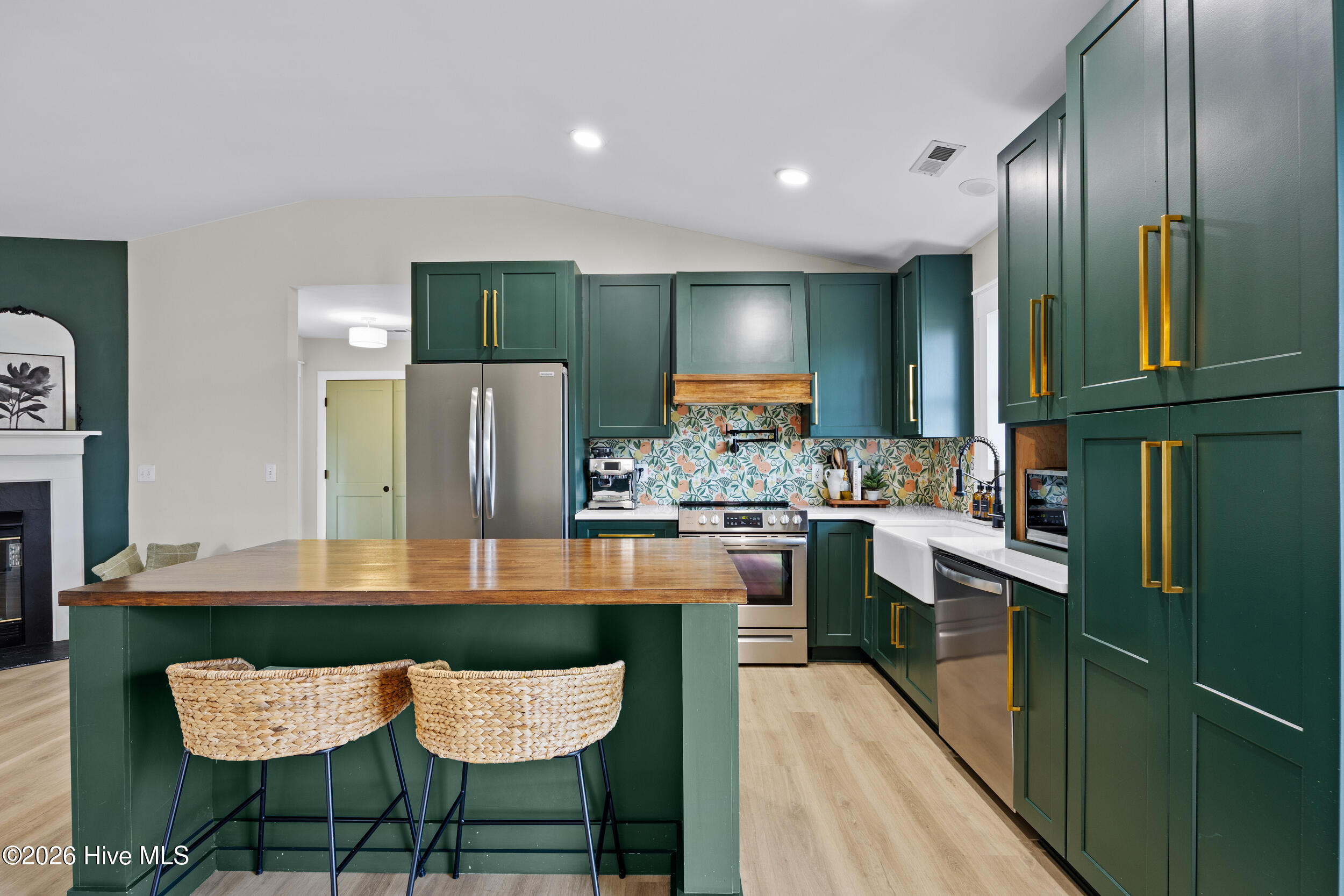 Gourmet kitchen..custom hood,pot filler, farm sink