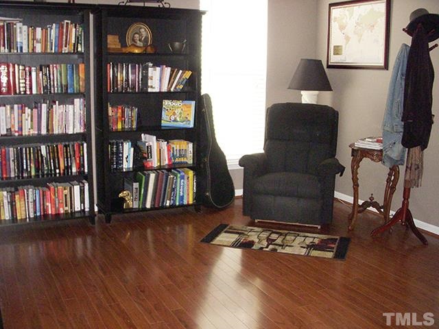 3809 Cathedral Bell Road Raleigh, NC 27614 - Photo 15 of 25 a living room with furniture and a book shelf