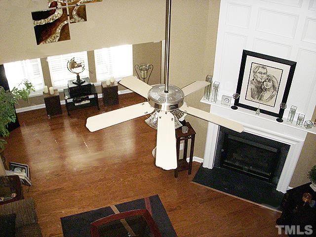 3809 Cathedral Bell Road Raleigh, NC 27614 - Photo 20 of 25 a living room with furniture and a fireplace
