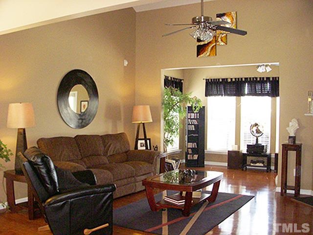 3809 Cathedral Bell Road Raleigh, NC 27614 - Photo 3 of 25 a living room with furniture a rug and a window