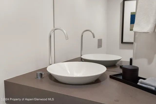 a view of a bathroom with a tub and mirror