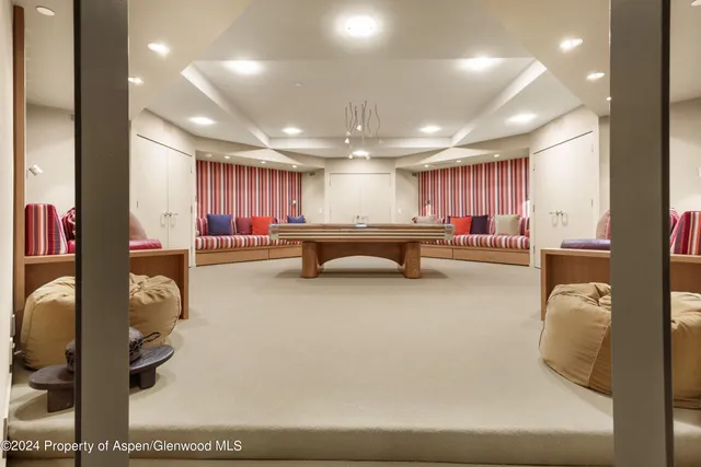 a large white kitchen with a large window