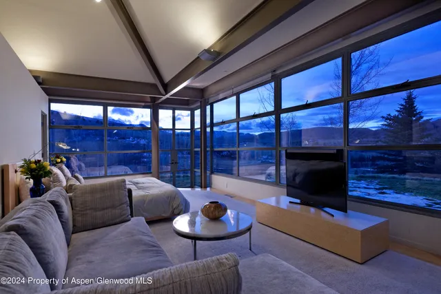 a living room with furniture a lamp and a fireplace
