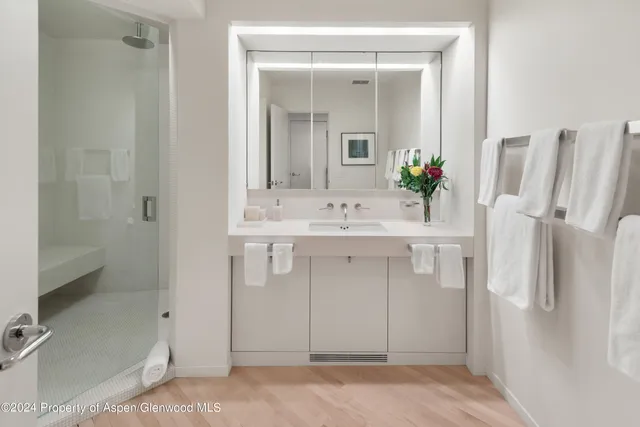 a bathroom with a sink and mirror