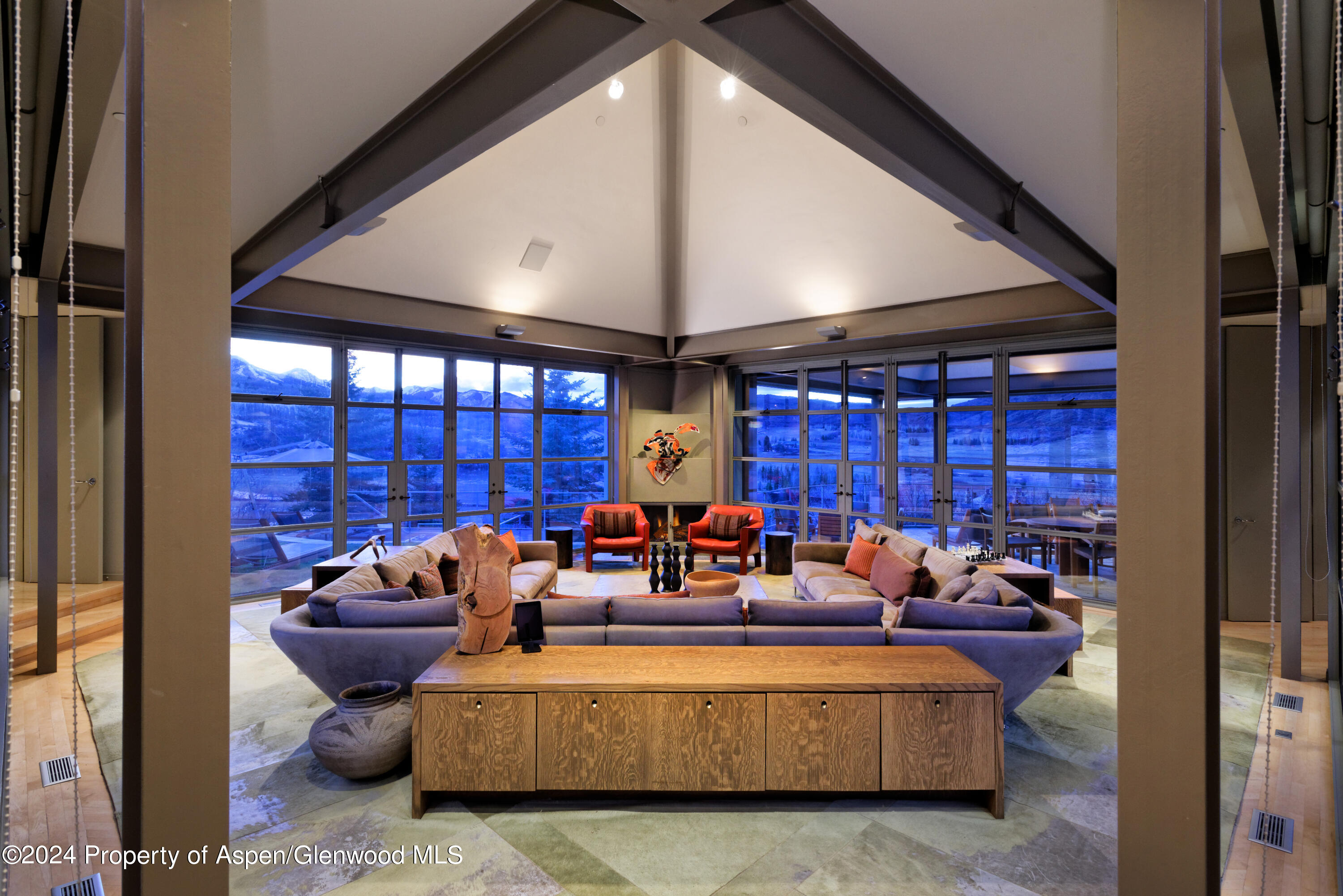 821 Cluny Road Aspen, CO 81611 - Photo 3 of 42 a living room with furniture fireplace and a large window