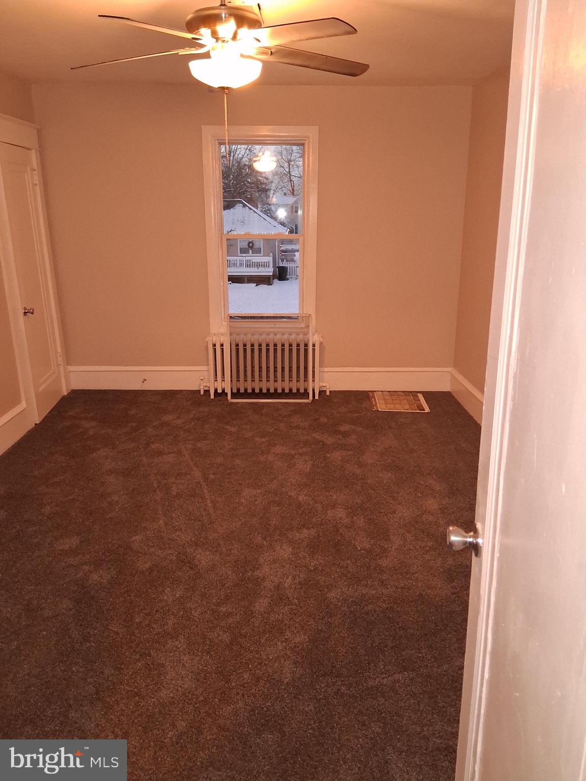 223 South Grand Street, Unit 2 Hammonton, NJ 08037 - Photo 6 of 10 a view of an empty room and chandelier fan