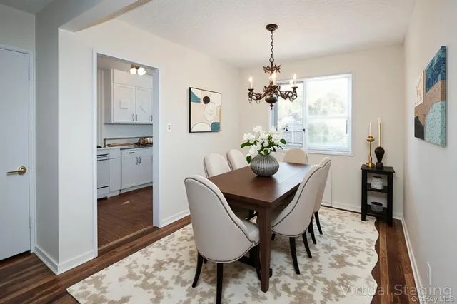 a view of a dining room with furniture and window