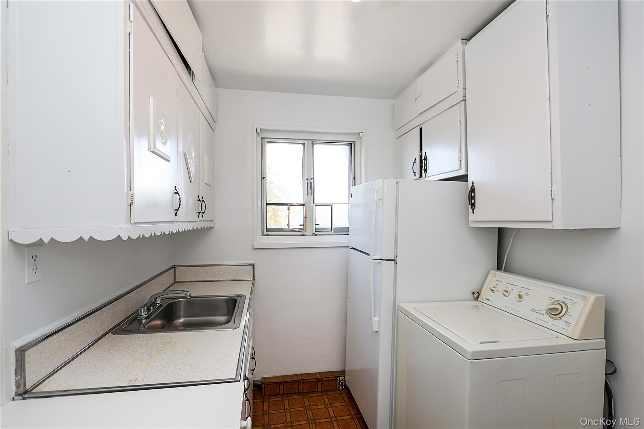 220-04 Stronghurst Avenue, Unit 185 Queens, NY 11427 - Photo 23 of 33 a room with storage and utility