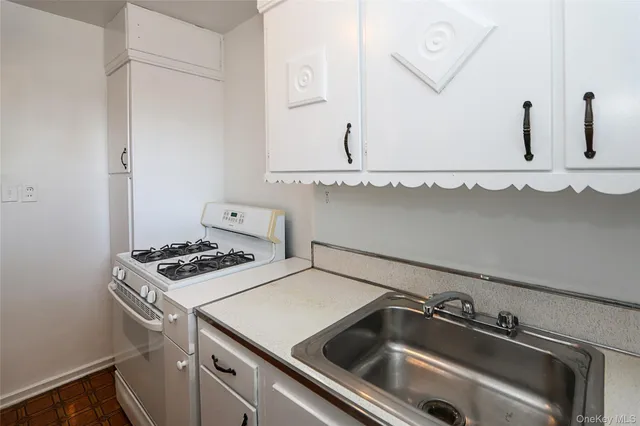 a bathroom with a sink and a stove